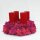 Adventskranz mit rosa und fuchsia Islandmoos und vier roten Kerzen